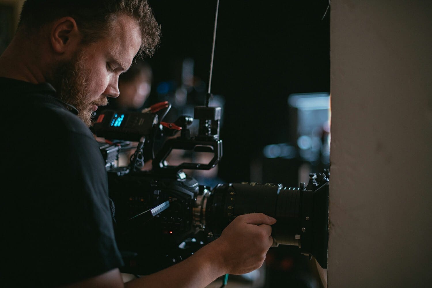 bearded man looks at video camera